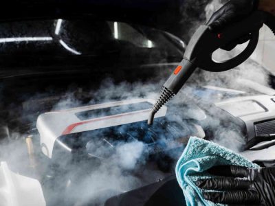 Car-engine-steam-cleaning-at-a-car-detailing-shop-1080x675